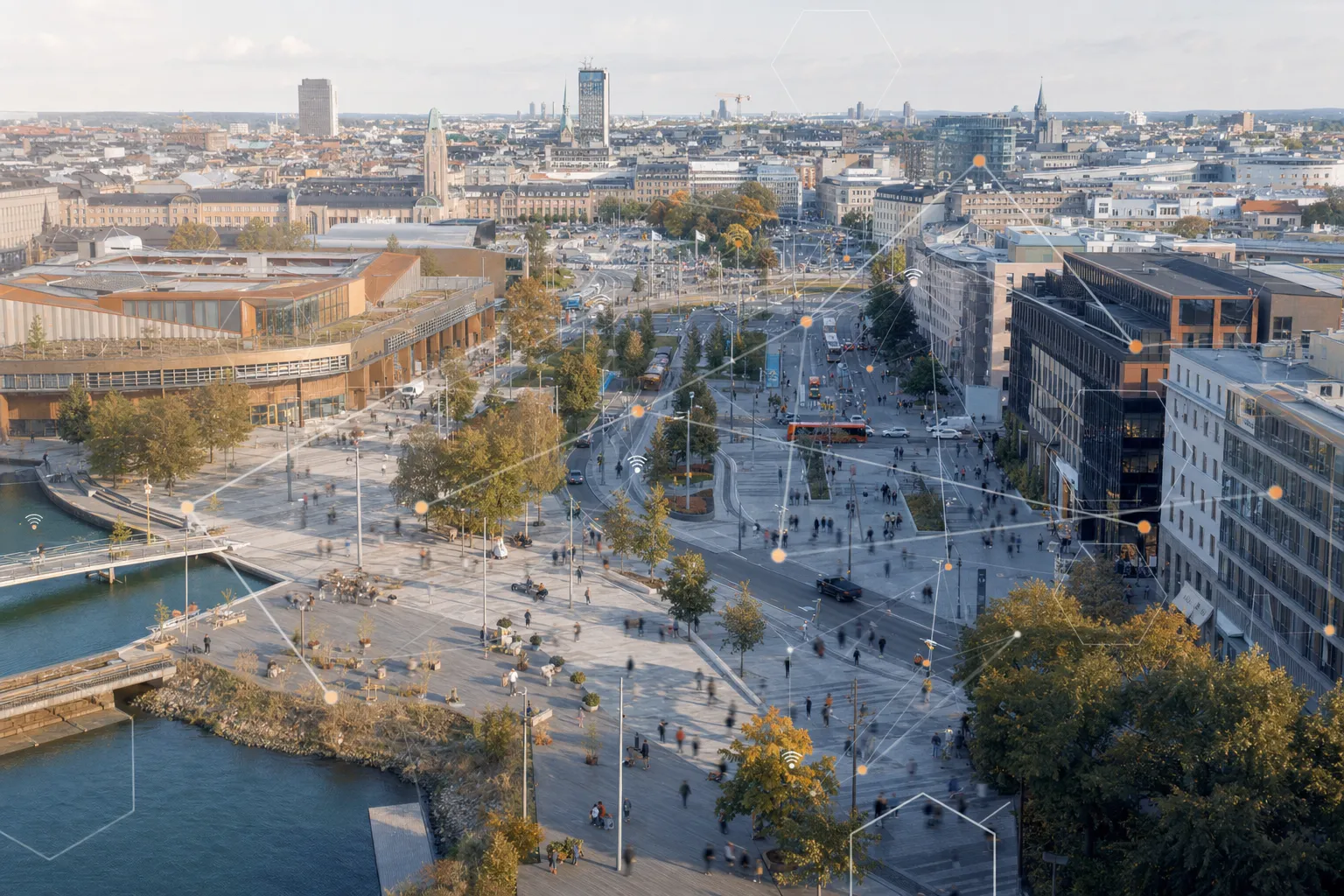 Luchtfoto van een Scandinavisch stadsdeel met mensen en verkeer die tussen buurten stromen, met een subtiel netwerkraster eroverheen.
